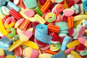 tasty colorful jelly candies as background above view 700 338375491